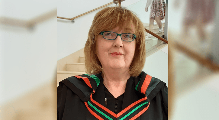 Joan Cochrane pictured at Waterfront Hall in graduation gown